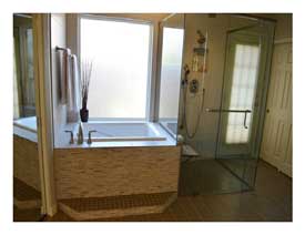 Gilbert AZ master bathroom remodel with soaking tub, a large open shower and light quartz counters.