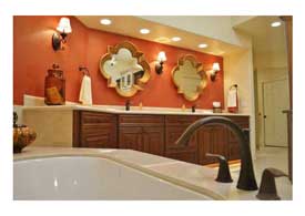 Gilbert AZ master bathroom remodel with dark wood cabinets and light granite counters.