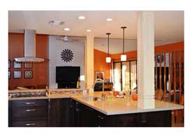 Gilbert AZ open concept kitchen remodel with dark wood cabinets and peninsula seating.