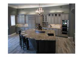 Chandler AZ open concept kitchen remodel with custom gray cabinetry and seating at a large island.