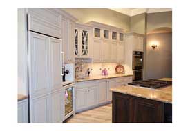 Chandler AZ open concept kitchen remodel with custom gray cabinetry and seating at a large island.