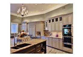 Ahwatukee AZ kitchen remodel with custom gray cabinetry and a large island with seating..
