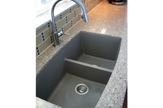 Mesa, AZ kitchen remodeling contractor. Open concept galley kitchen with gray quartz counter tops and white cabinets.