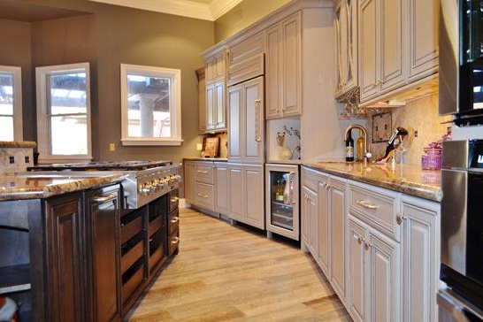 Scottsdale kitchen remodeling contractor featuring an open, modern kitchen, large functional island and chandelier.