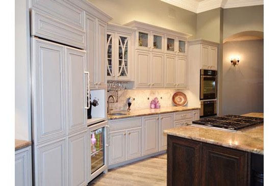 Scottsdale kitchen remodeling contractor featuring an open, modern kitchen, large functional island and chandelier.