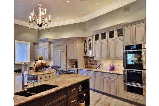 Scottsdale kitchen remodeling contractor featuring an open, modern kitchen, large functional island and chandelier.