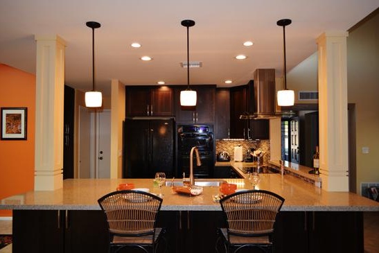 Scottsdale, AZ Kitchen remodeling Contractor featuring peninsula seating, columns and pendant lighting.